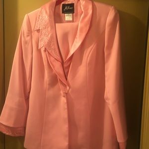 Brand new skirt suit with tags.